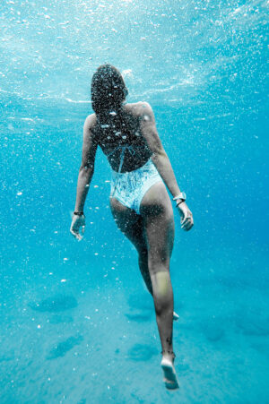 Girl Swimming Underwater Photographic Print Poster